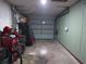 Cluttered garage with various items, tools, and bicycles at 601 E Tall Pine Ter, Deland, FL 32724