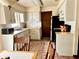 Bright eat-in kitchen features white cabinetry and black appliances at 601 E Tall Pine Ter, Deland, FL 32724