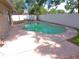 Backyard featuring a sparkling pool with plenty of lounging space at 601 E Tall Pine Ter, Deland, FL 32724