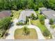 Expansive aerial view of this meticulously maintained property, showcasing lush lawns and mature trees at 69 Coquina Ridge Way, Ormond Beach, FL 32174