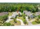 A lovely aerial view showing landscaping around the front of the home and surrounding greenery at 69 Coquina Ridge Way, Ormond Beach, FL 32174