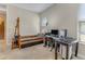 Comfortable bedroom featuring a single bed, desk, and natural light, perfect for relaxation and productivity at 69 Coquina Ridge Way, Ormond Beach, FL 32174