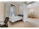 Bedroom with a pull down bed, window, and open door into the dining room at 69 Coquina Ridge Way, Ormond Beach, FL 32174