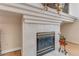Elegant fireplace with tile surround and decorative mantel, creating a warm and inviting focal point at 69 Coquina Ridge Way, Ormond Beach, FL 32174