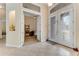 Spacious foyer featuring tile flooring and decorative glass doors at 69 Coquina Ridge Way, Ormond Beach, FL 32174