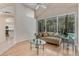 Bright living room with stylish chaise lounge and view of the pool at 69 Coquina Ridge Way, Ormond Beach, FL 32174