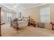 Bright primary bedroom boasting tray ceiling and ample space at 69 Coquina Ridge Way, Ormond Beach, FL 32174