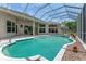 Inviting screened-in pool area, perfect for relaxation and outdoor entertaining at 69 Coquina Ridge Way, Ormond Beach, FL 32174