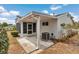 The backyard has a covered patio, an A/C unit, lush landscaping, and a screened-in porch for relaxation at 8720 Sw 108Th Ln, Ocala, FL 34481