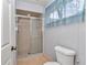 Bathroom with tiled shower and floors at 8720 Sw 108Th Ln, Ocala, FL 34481