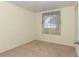 Cozy bedroom with neutral carpet and a window offering natural light at 8720 Sw 108Th Ln, Ocala, FL 34481