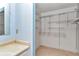 This blue bathroom features a vanity with walk in closet at 8720 Sw 108Th Ln, Ocala, FL 34481