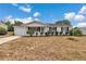 Charming single-story home with a well-maintained lawn and mature landscaping at 8720 Sw 108Th Ln, Ocala, FL 34481