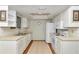 Well-lit kitchen featuring a functional layout with white cabinets and modern appliances at 8720 Sw 108Th Ln, Ocala, FL 34481