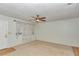 Bright living room featuring carpet, ceiling fan, and window with curtains at 8720 Sw 108Th Ln, Ocala, FL 34481