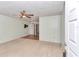 Bright living room featuring carpet, ceiling fan, and sliding doors at 8720 Sw 108Th Ln, Ocala, FL 34481