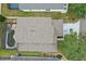 Aerial view of a home featuring a swimming pool, screened in patio, and driveway at 1305 Rebecca Dr, Haines City, FL 33844