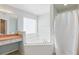 Bathroom with a large corner tub, a shower and vanity at 1305 Rebecca Dr, Haines City, FL 33844
