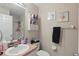 Bathroom featuring a sink, shower, and framed pictures at 1305 Rebecca Dr, Haines City, FL 33844