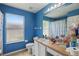 Bathroom featuring a sink, large vanity, and a window for natural light at 1305 Rebecca Dr, Haines City, FL 33844