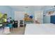 Light blue bedroom featuring carpeting, and a closet. Storage boxes on a table at 1305 Rebecca Dr, Haines City, FL 33844