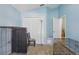 Bedroom with neutral carpet, large closet, an open door, and natural light at 1305 Rebecca Dr, Haines City, FL 33844
