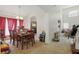Inviting dining room featuring a large table, chandelier, and arched entryway to other rooms at 1305 Rebecca Dr, Haines City, FL 33844