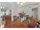 Inviting dining room featuring a large table, chandelier, and arched entryway to other rooms at 1305 Rebecca Dr, Haines City, FL 33844
