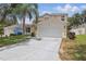 Charming two-story home with a well-manicured lawn and a spacious two-car garage at 1305 Rebecca Dr, Haines City, FL 33844