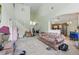 Bright living room with high ceilings, tile flooring, and large windows, offering ample natural light at 1305 Rebecca Dr, Haines City, FL 33844