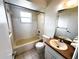 Bathroom with standard bathtub and shower features a single sink and ample counter space at 1355 Dexter E Dr, Port Orange, FL 32129