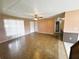 Open-concept living area with tile flooring, ceiling fan, and access to other rooms at 1355 Dexter E Dr, Port Orange, FL 32129