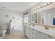 Bright bathroom with double vanity, tub and tile flooring at 1956 Southern Dunes Blvd, Haines City, FL 33844
