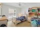 Bright, airy bedroom with a ceiling fan, a window, and classic furniture at 1956 Southern Dunes Blvd, Haines City, FL 33844