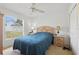 Well-lit bedroom featuring a ceiling fan, a window, and traditional furniture at 1956 Southern Dunes Blvd, Haines City, FL 33844