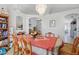 Dining room featuring a decorative chandelier, archways, and views into other living spaces at 1956 Southern Dunes Blvd, Haines City, FL 33844
