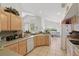 Functional kitchen offering ample counter space and a view into the breakfast nook and backyard at 1956 Southern Dunes Blvd, Haines City, FL 33844