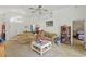Spacious living room with high ceilings, ceiling fan, and a view towards other rooms in the house at 1956 Southern Dunes Blvd, Haines City, FL 33844