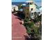 Aerial view of a colorful three-story coastal home with balconies and ample parking at 3000 Ocean Shore Blvd # 150, Ormond Beach, FL 32176