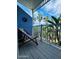 Enjoy tropical vibes on this shaded outdoor balcony with a relaxing lounge chair at 3000 Ocean Shore Blvd # 150, Ormond Beach, FL 32176
