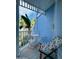 Cozy shaded outdoor balcony furnished with small table and chairs for relaxing at 3000 Ocean Shore Blvd # 150, Ormond Beach, FL 32176