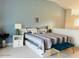 Well-lit bedroom with a queen bed features decoratively matched lamps and wall color at 3000 Ocean Shore Blvd # 150, Ormond Beach, FL 32176