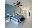 Comfortable bedroom with a queen bed features decoratively matched lamps and wall color at 3000 Ocean Shore Blvd # 150, Ormond Beach, FL 32176