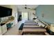 Spacious bedroom with desk, work area and large sliding glass doors to the outside at 3000 Ocean Shore Blvd # 150, Ormond Beach, FL 32176