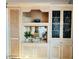 Large custom built-in cabinetry with shelving, cabinets and decorative details enhances the room at 3000 Ocean Shore Blvd # 150, Ormond Beach, FL 32176
