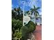 Barrier Island community sign with tropical landscaping and colorful coastal homes in the background at 3000 Ocean Shore Blvd # 150, Ormond Beach, FL 32176