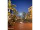 Exterior of tropical homes with palm trees and brick paved driveway at night at 3000 Ocean Shore Blvd # 150, Ormond Beach, FL 32176