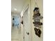 Hallway with coastal decor and a sign displaying beach-themed sayings at 3000 Ocean Shore Blvd # 150, Ormond Beach, FL 32176