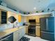 Bright, modern kitchen with stainless steel appliances and stylish countertops at 3000 Ocean Shore Blvd # 150, Ormond Beach, FL 32176