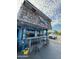 Fun and funky outdoor dining area with bar seating at a local eatery, with a cloudy sky overhead at 3000 Ocean Shore Blvd # 150, Ormond Beach, FL 32176